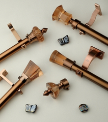Copper Finish Curtain Rod with Designer Crystal Finials Decorative copper curtain rod system with crystal finials and premium mounting brackets for luxury interiors.